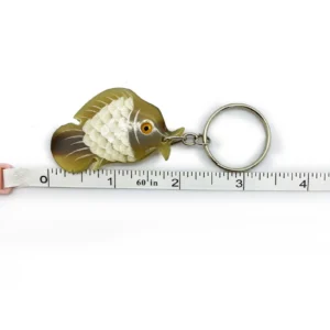 Buffalo horn fish keychain on a keyring — in hand