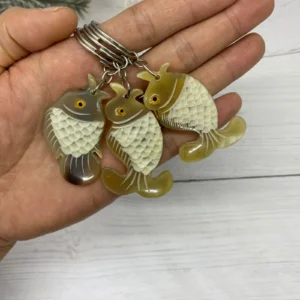 Buffalo horn fish keychain — close-up of polished surface