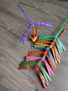 Dozens of hand-painted bamboo dragonflies in assorted colours