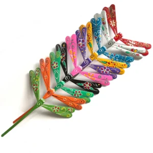 Painted bamboo dragonfly set — arranged on a shelf
